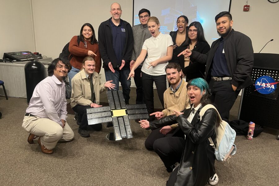 Group of students participating in NASA Community College Aerospace Scholars (NCAS) program pose for picture