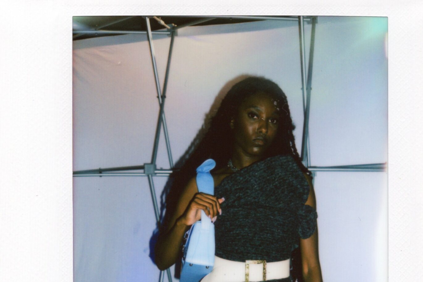 Woman poses in front of the camera before Fashion Show