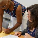 Instructor helps a student