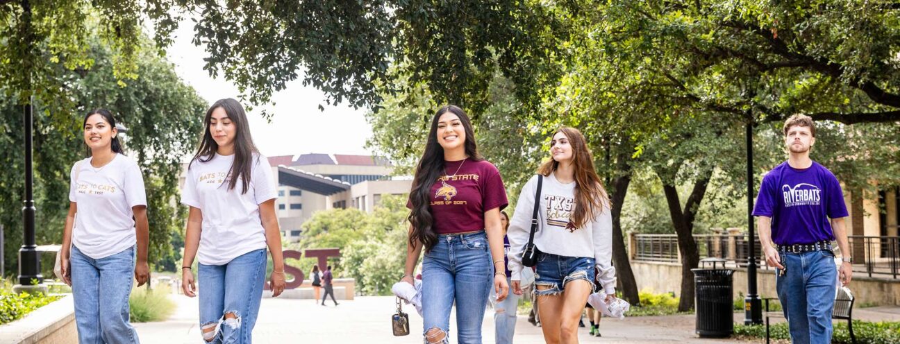 ACC Students and Texas State University students walk to class together.