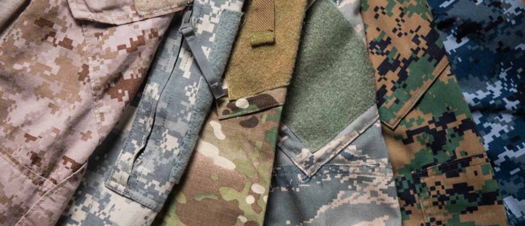 Different US Military uniform camouflage designs representing Marine corps, Army, Airforce and Navy.
