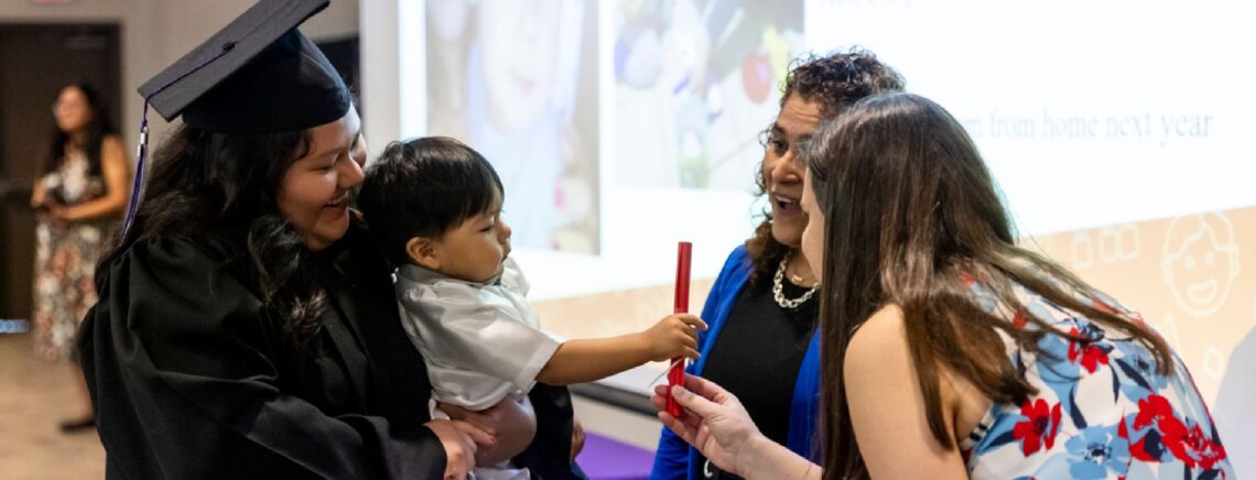 An ACC student with her family and child during graduation